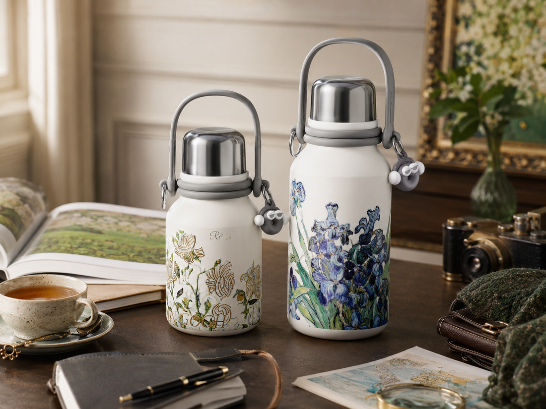 34 oz and 51 oz floral titanium flasks compared on a travel desk
