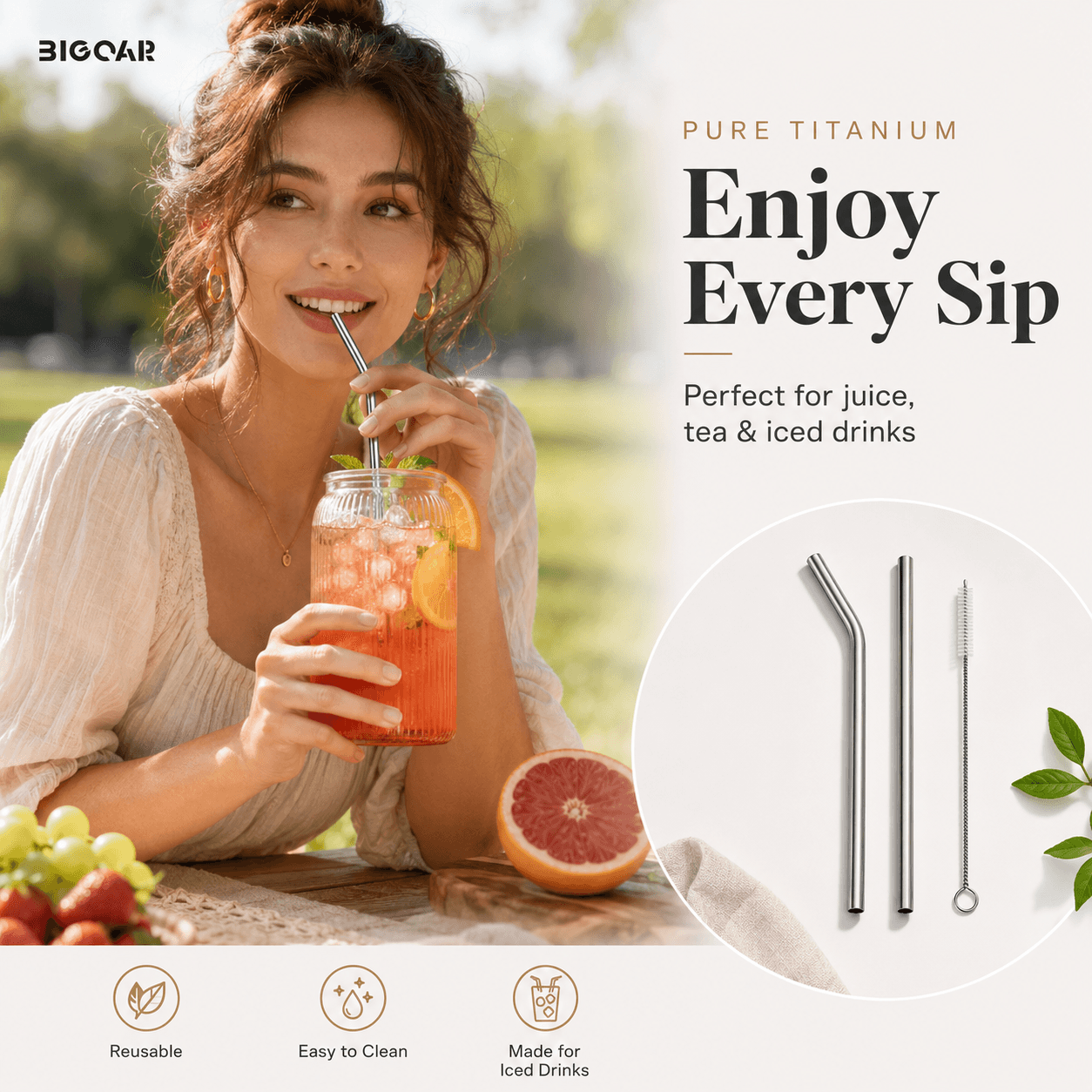Young woman enjoying an iced fruit drink with a reusable pure titanium straw set outdoors