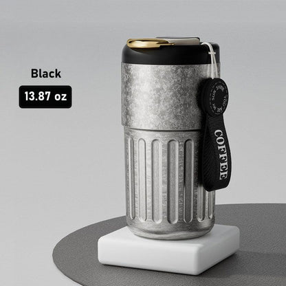 GearMoor Smart Mug Lifestyle Shot - Commuter Holding Titanium Travel Cup
